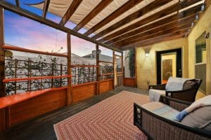 Screened pergola porch with a wood deck at 1211 W Polk St